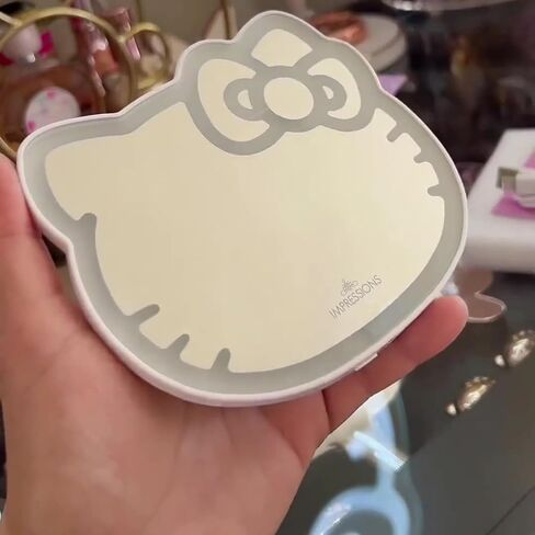 Impressions Vanity Hello Kitty 3X Magnifying Pocket Mirror with Stand, Adjustable Brightness Daylight LED Lighted Compact Makeup Mirror for Desk, Travel, Purse (Pink) in Kuwait