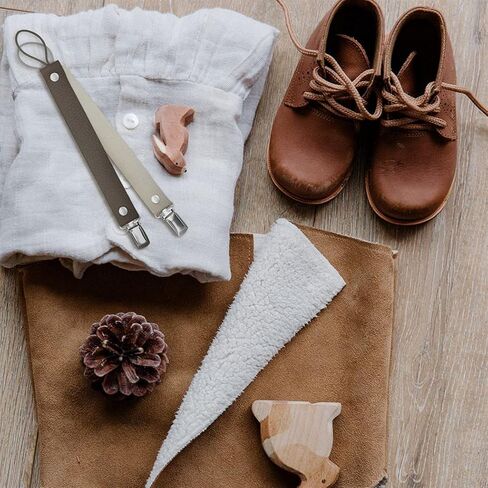 Giga Pack of 2 Baby Pacifier Clips are Handmade with 100percent Natural Leather Material and Our Product which has Prevents The Little Ones' Pacifiers Small Toys and teether Dark Brown and White in Saudi Arabia
