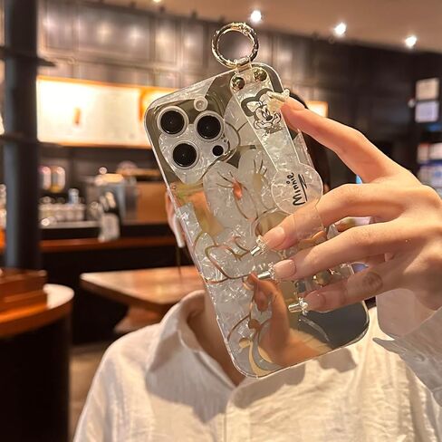 حافظة لهاتف iPhone 16 Pro Max مقاس 6.9 بوصات مع حزام معصم ومسند لامع بتصميم كرتوني لطيف لامع وناعم ومتين ومقاوم للصدمات للفتيات والنساء - ميني in Saudi Arabia
