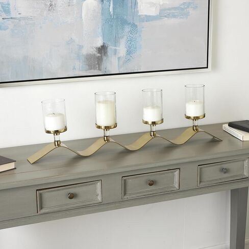 The Novogratz Stainless Steel Metal 4 Candle Hurricane Lamp with Wavy Base, 33" x 4" x 10", Gold in Saudi Arabia