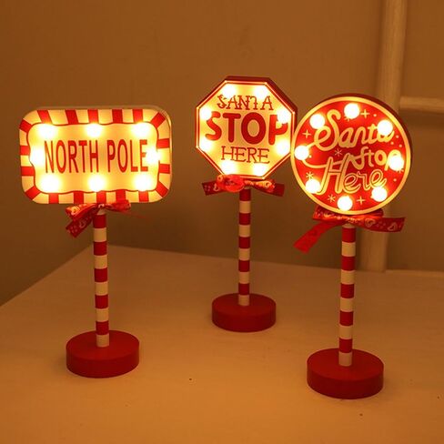 Christmas Decorations Santa Stop Here Pole Sign with LED Light Xmas Tabletop Stand Decor for Indoor Home Office Holiday Party Decorative Christmas Street Sign Holiday Housewarming Gift (octagon) in Saudi Arabia
