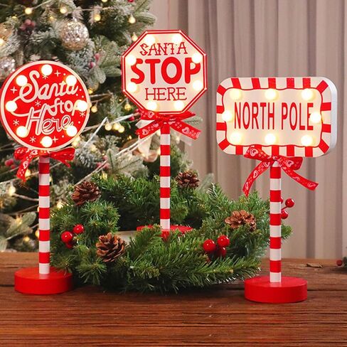 Christmas Decorations Santa Stop Here Pole Sign with LED Light Xmas Tabletop Stand Decor for Indoor Home Office Holiday Party Decorative Christmas Street Sign Holiday Housewarming Gift (octagon) in Saudi Arabia
