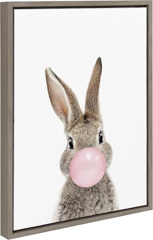 لوحة فنية جدارية من القماش مؤطرة من Kate and Laurel Sylvie Bubble Gum Bunny من تصميم Amy Peterson Art Studio، مقاس 18 × 24 طبيعية، فن حيوان غريب الأطوار لطيف للجدار in Saudi Arabia