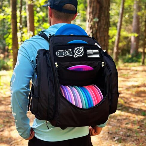 Discology Disc Golf OG V2 Grey & Black Disc Golf Bag | 26+ Disc Capacity | Premium Disc Golf Backpack Bag | Durable Design | 2 Large Side Compartments | Two Patches Included - Flag Patch Not Included in Saudi Arabia