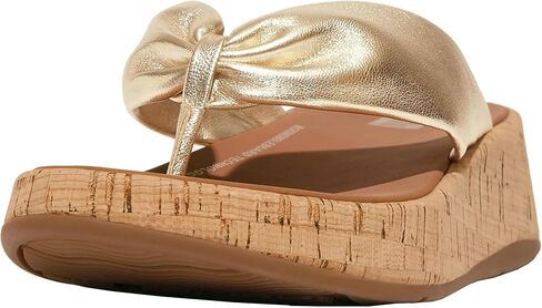 صندل نسائي من FitFlop مصنوع من الجلد ذو شكل F-Twist ذو مقدمة مسطحة (فلين) ويدج in Saudi Arabia