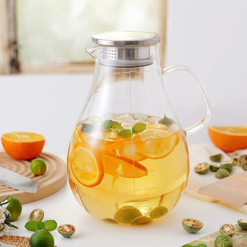 Glass Pitcher with Lid, 70oz/2 Liter Glass Water Jug with Coaster and Brush,Heat and Cold Resistance for Coffee, Juice, Hot/Cold Beverages,Lemonade and Milk in Saudi Arabia