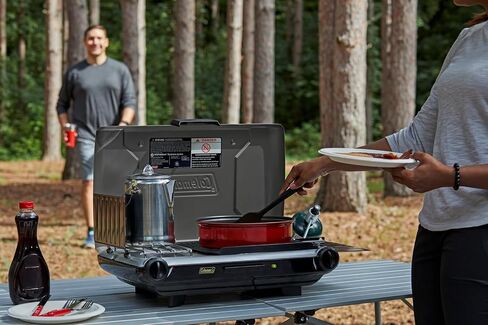 Coleman Tabletop 2-in-1 Grill & Stove with 2 Adjustable Burners, Propane Grill/Stove with Push-Button Starter, Wind Guards, Grease Tray, & 20,000 BTUs of Power for Camping, Tailgating, & More in Saudi Arabia