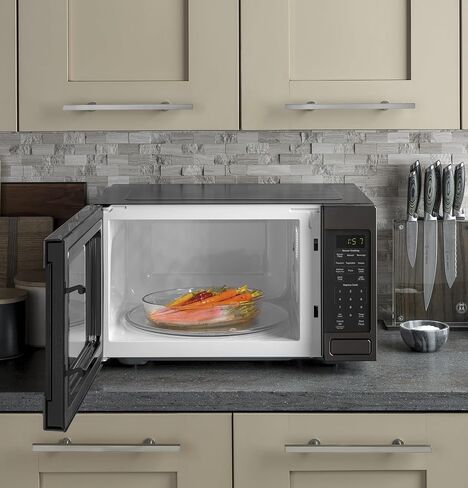 GE JES1657DMWW Microwave Oven, 1,150-watt Capacity, Cubic, 8 Auto Cooking Settings, Kitchen Essentials for the Countertop, Dorm Room or Apartment, White, OLD 1.6 Cu. Ft in Saudi Arabia