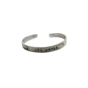 Chi Omega Cuff Bracelet - handstamped in a whimsical font on a non tarnish aluminum cuff, officially licensed