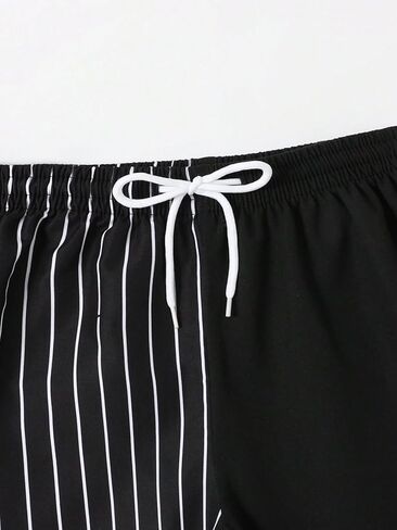 OYOANGLE Boy's Color Block Cartoon Graphic Board Swim Trunks Drawstring Waist Bathing Suit Beach Shorts Black Letter 14Y in Saudi Arabia