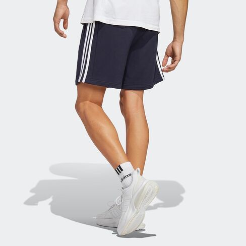 شورت رجالي من adidas مقاس Essentials French Terry 3-Stripes، مقاس متوسط ​​رمادي منقط، كبير/طويل in Saudi Arabia