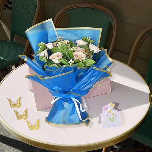مجموعة ورق تغليف باقة زهور من FreshDear مكونة من 20 ورقة مع شريط من الساتان بطول 24 ياردة، وخيوط الجوت بطول 5 ياردات، و12 قطعة من الفراشات الذهبية ثلاثية الأبعاد، و5 بطاقات تهنئة - مثالية لتزيين حفلات الزفاف والهدايا (أزرق ملكي) in Saudi Arabia