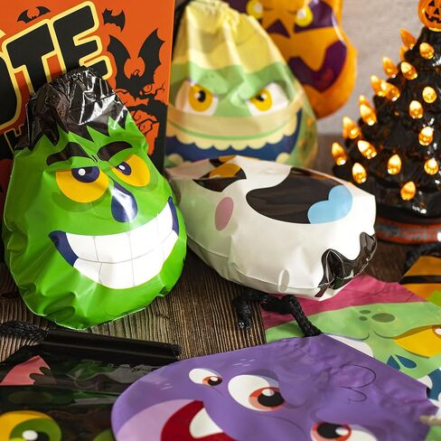 JOYIN 60PCS Halloween Drawstring Treat Bags, Goodie Candy Trick or Treat Bags Bulk in 12 Cute Monster Designs, Small Plastic Gifts Bags for Kids Trick or Treating, Halloween Party Favors Supplies in Saudi Arabia