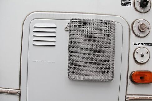 شاشة الحشرات الطائرة من Camco مع أداة التثبيت - WH 600، شبكة متينة من الفولاذ المقاوم للصدأ، تناسب فتحات سخان المياه 10 و12 و16 جالون (42146)، 9.75 بوصة × 7.4 بوصة × 1.3 بوصة، فضي in Saudi Arabia
