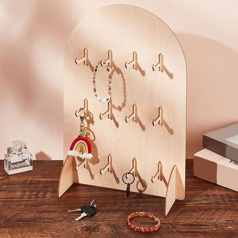 حامل عرض PH PandaHall Pegboard، حامل عرض سوار خشبي كبير على شكل قوس، حامل منظم المجوهرات على سطح الطاولة مع 12 خطافًا لبطاقات القرط، والقلائد، وسلاسل المفاتيح، وخشب Burlywood، 5.9x5.9x15.8 بوصة in Saudi Arabia