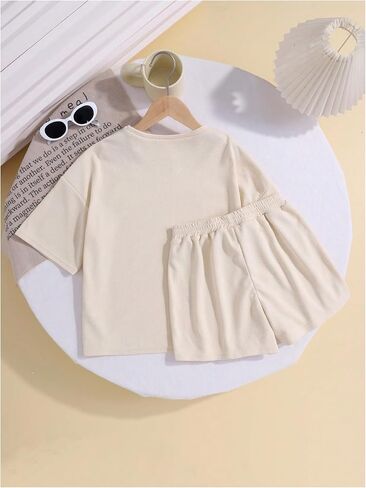 Girl's 2 Piece Outfits Drop Shoulder Short Sleeve Tee Shirt and Track Shorts Sets Summer Cute Clothes in Saudi Arabia