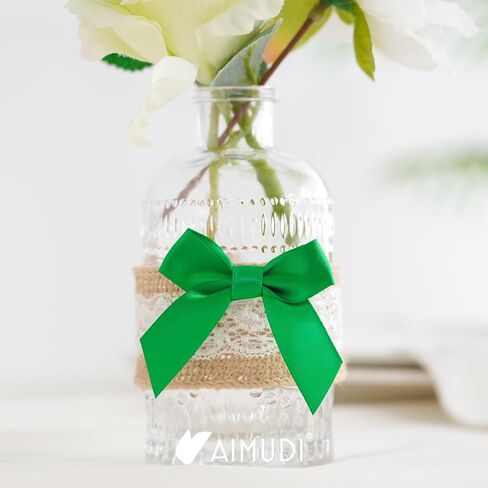 AIMUDI أقواس شريط من الساتان الأخضر مقاس 5.08 سم ذاتية اللصق من الساتان لتغليف الهدايا، أقواس شريطية مصنوعة مسبقًا مع شريط مزدوج الجوانب لصنع الحرف اليدوية وحفلات أعياد الميلاد وحفلات الزفاف، 50 قطعة in Saudi Arabia