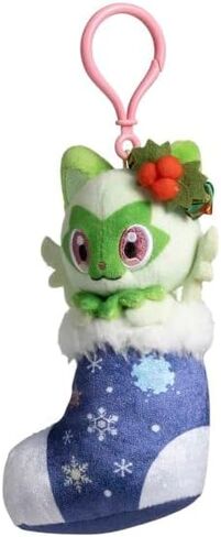 مركز البوكيمون: سلسلة مفاتيح Sprigatito Pokémon Holiday Festival من القطيفة - 6 ¼ بوصة. in Saudi Arabia