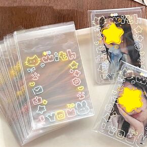 100 قطعة من أكياس السيلوفان الشفافة ذاتية الغلق من Yajuo، أكمام بطاقات صور مزخرفة بطباعة كرتونية، أكياس تغليف لطيفة ذاتية اللصق، حقائب هدايا صغيرة، أكياس حلوى شفافة لحلوى البسكويت (3.94 * 3.15 بوصة) in Kuwait