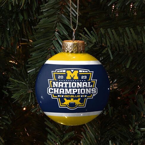زخرفة الأبطال الوطنيين لكرة القدم الجامعية في ميشيغان NCAA 2023 - 2 5/8 بوصة زخرفة شجرة الكرة الزجاجية - جانبان - البحرية والذرة in Kuwait
