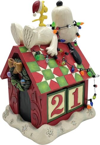 Enesco Peanuts by Jim Shore Snoopy's Dog House Christmas Countdown Calendar Figurine- Stone Resin Hand Crafted Painted Collectible Peanuts Snoopy Figurines Christmas Home Decor Statue, 7.09 Inch in Saudi Arabia