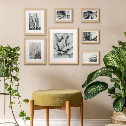 ArtbyHannah 7 Pack Gallery Wall Picture Frames Sets with Decorative Botanical Art Prints for Photo Frame Collages for Home Decoration, Natural Frames, Multiple Sizes One 11x14, Two 8x10, Four 5x7 in Saudi Arabia