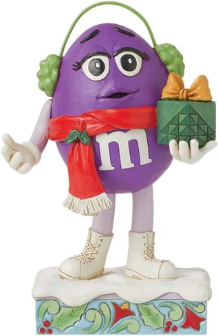 Enesco M&M's by Jim Shore M&M شخصية أرجوانية تحمل تمثال هدية - تمثال حلوى M&M مطلي يدويًا من الراتنج الحجري، تمثال ديكور منزلي لعيد الميلاد، 6.3 بوصة in Saudi Arabia