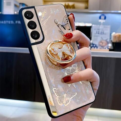 حافظة Galaxy S23 بمسند، غطاء حماية مضاد للصدمات على شكل قوقعة رخامية لطيفة على شكل فراشة مع حلقة أنيقة من حجر الراين الماسي للفتيات والنساء لهاتف Samsung Galaxy S23 2023 (أرجواني) in Kuwait