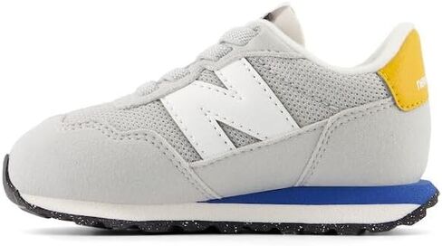 New Balance Kids 237 Bungee Sneaker, NB NAVY/VARSITY GOLD, 7.5 M Toddler (1-4 Years) in Saudi Arabia