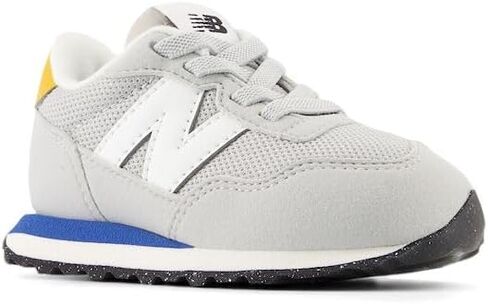 New Balance Kids 237 Bungee Sneaker, NB NAVY/VARSITY GOLD, 7.5 M Toddler (1-4 Years) in Saudi Arabia