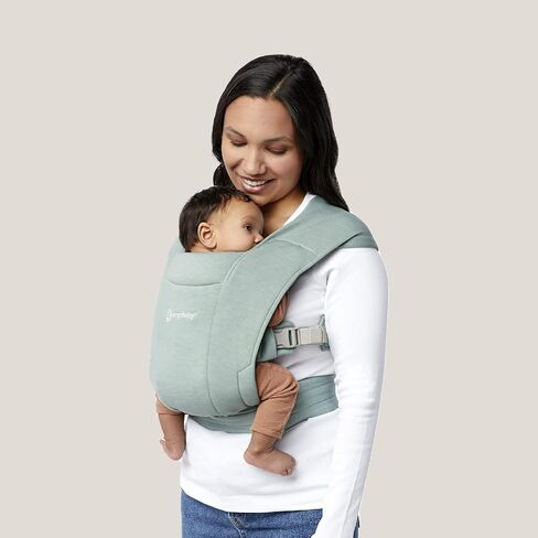 حاملة لفافة الأطفال حديثي الولادة Embrace Cozy من Ergobaby (7-25 كجم)، نسيج بونتي، جملي in Kuwait