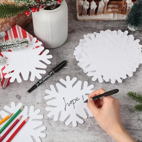Qilery 100 Pcs Large Paper Snowflakes Cutouts with 2 Pcs Marker Pens Winter Snowflakes Bulletin Board Cutouts for Classroom Decor Xmas Winter Party Supplies in Saudi Arabia