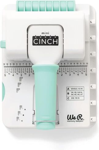 آلة تجليد الكتب We R Memory Keepers Mini Cinch، بيضاء، أداة صغيرة، تصميم سهل الاستخدام مع مسطرة، متوافقة مع الأسلاك أو الملفات الحلزونية، اصنع كتبًا احترافية وأجهزة الكمبيوتر المحمولة والتقويمات والمزيد in Kuwait