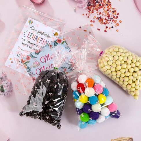 SOMIOCO Clear Gift Bags 6X11In 100PCS Cello Cellophane Treat Bags Party Favor Bags Clear Candy Cookie Bags Plastic Poly Goodie Bags with Twist Tie for Birthday,Baby shower,Wedding,party(Pink Bow) in Kuwait