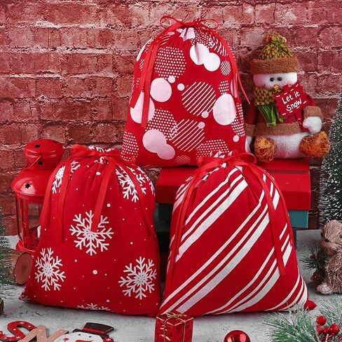 Aneco 12 قطعة حقيبة عيد الميلاد برباط باللونين الأحمر والأبيض حقيبة هدايا عيد الميلاد مع أكياس تغليف هدايا قطنية برباط مقاس 9.8 × 11.8 بوصة هدايا حفلات عيد الميلاد، 6 تصميم in Kuwait