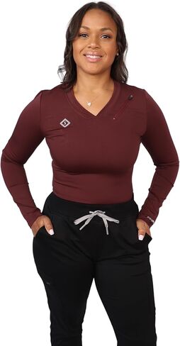 تي شيرت Scrubates Under Scrubs للنساء - تي شيرت نسائي طبي بأكمام طويلة ورقبة على شكل حرف V مع جيب بسحاب in Kuwait