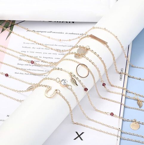JOERICA 16 Pcs Gold Layered Necklaces Choker Chain Y Necklace Set for Women Disc Bar Shell Feather Horn Blessed Virgin Mary Pendant Necklace Jewelry Gift in Saudi Arabia