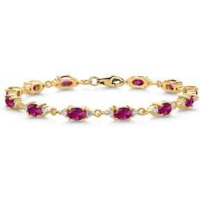 Gem Stone King 18K Yellow Gold Plated Silver Red Created Ruby and White Moissanite Tennis Bracelet For Women (6.91 Cttw, Gemstone Birthstone, Oval 6X4MM, 6.5 Inch)