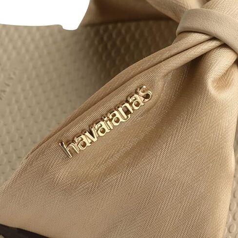 شبشب نسائي من Havaianas You St. Tropez Lush Flip Flops - صنادل أنيقة ومريحة ومتينة بحزام من الساتان للشاطئ والارتداء الكاجوال واليومي، تتضمن حقيبة مخملية، 7-8 in Saudi Arabia