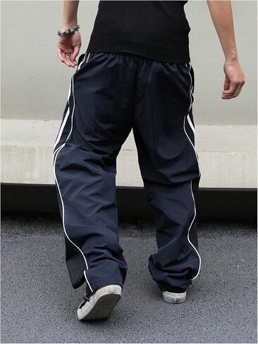 MakeMeChic Men's Drawstring Striped Colorblock Wide Leg Trousers Pocket Loose Baggy Y2K Parachute Pants in Saudi Arabia
