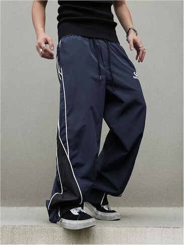 MakeMeChic Men's Drawstring Striped Colorblock Wide Leg Trousers Pocket Loose Baggy Y2K Parachute Pants in Saudi Arabia