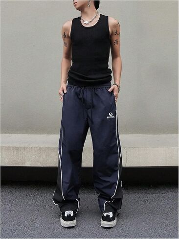 MakeMeChic Men's Drawstring Striped Colorblock Wide Leg Trousers Pocket Loose Baggy Y2K Parachute Pants in Saudi Arabia