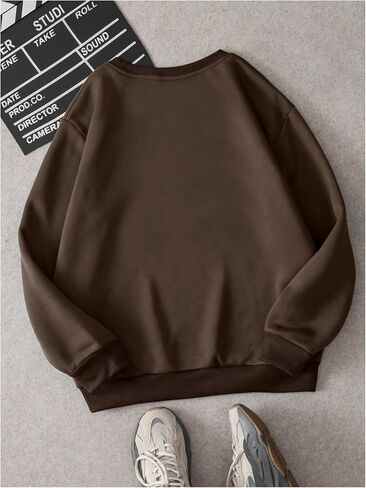 WDIRARA Women's Cartoon Duck Printed Crew Neck Sweatshirt Graphic Long Sleeve Loose Pullover in Saudi Arabia