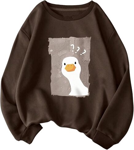 WDIRARA Women's Cartoon Duck Printed Crew Neck Sweatshirt Graphic Long Sleeve Loose Pullover in Saudi Arabia