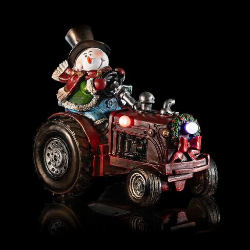 شركة Alpine Corporation 9 بوصة ارتفاع رجل ثلج بوليستون على زينة عطلة الجرار مع أضواء LED متغيرة الألوان، زينة عيد الميلاد in Kuwait