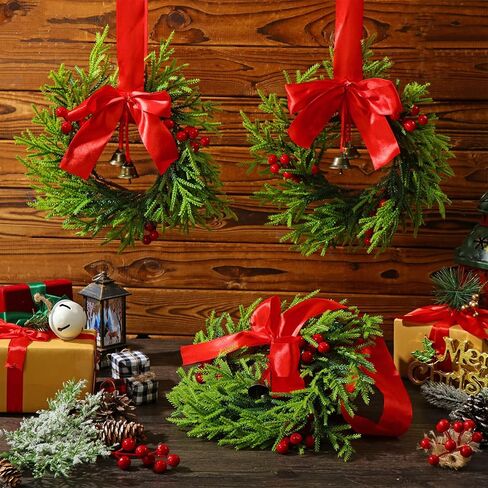 Dingion 4 Pieces 9.84 Inch Christmas Norfolk Pine Wreaths Small Xmas Artificial Pine Wreath Faux Pine Xmas Wreath Set with Berry and Bell for Xmas Front Door Porch Window Wall Decoration(Burlap Bows) in Kuwait