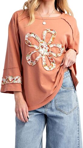 KevaMolly Womens Long Sleeve Tops Floral Patch Graphic Exposed Seam Wide Sleeve Sweatshirt Casual Pullover Top in Saudi Arabia