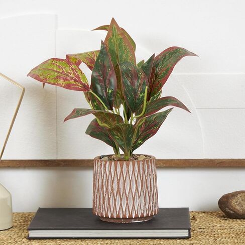 Deco 79 Faux Foliage Croton Artificial Plant with Geometric Patterned Pot and Decorative Pebbles, 10" x 13" x 14", Green in Saudi Arabia