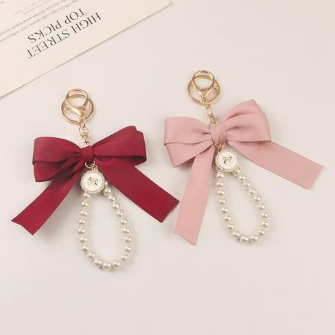 Caiyao لطيف Bowknot اللؤلؤ السوار سلاسل المفاتيح للنساء زنبق ساكورا زهرة حلقة رئيسية لسيارة محفظة قلادة حقيبة سحر in Kuwait