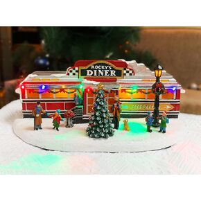 Christmas Village Building, Rocky's Diner, Retro 1950's Diner with LED Lights and Christmas Music - Battery Operated (not included) (optional 4.5V adapter not included) (5.8"H x 13.6"W x 7.1"D)